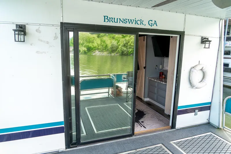Slide: The Image of 1991 Sumerset 65 x 14 Widebody Houseboat with sliding glass door, Brunswick, GA. - 40