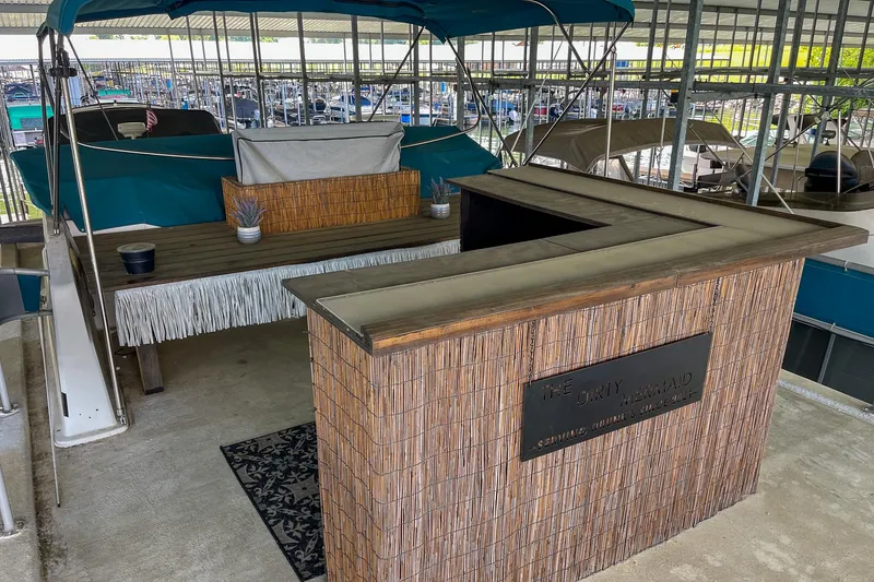 Slide: The Image of 1991 Sumerset 65 x 14 Widebody Houseboat with outdoor bar and seating area. - 47