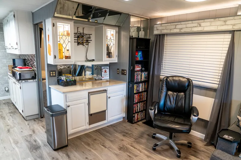 Slide: The Image of Interior of a 1991 Sumerset 65 x 14 Widebody Houseboat with modern decor. - 9