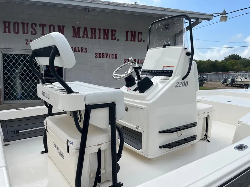 Slide: The Image of 2024 Pathfinder 2200 TRS boat at Houston Marine, featuring sleek design and modern controls. - 4