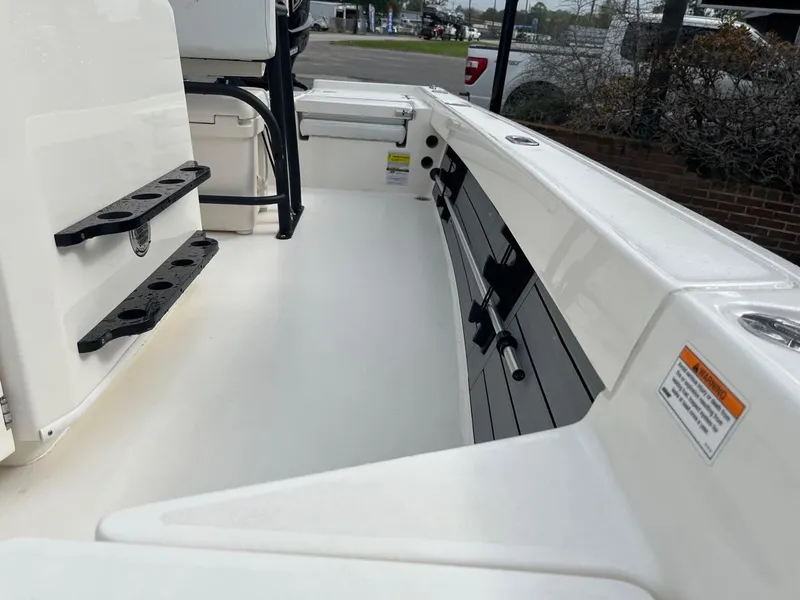 Slide: The Image of 2024 Pathfinder 2200 TRS boat interior, featuring sleek white design and storage compartments. - 6