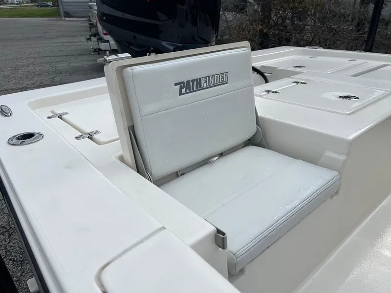 Slide: The Image of 2024 Pathfinder 2200 TRS boat seat, white upholstery, outdoor setting. - 7