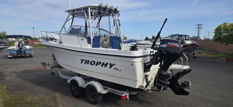 Slide: The Image of 2008 Trophy 2152WA boat on trailer with Suzuki outboard motor. - 12
