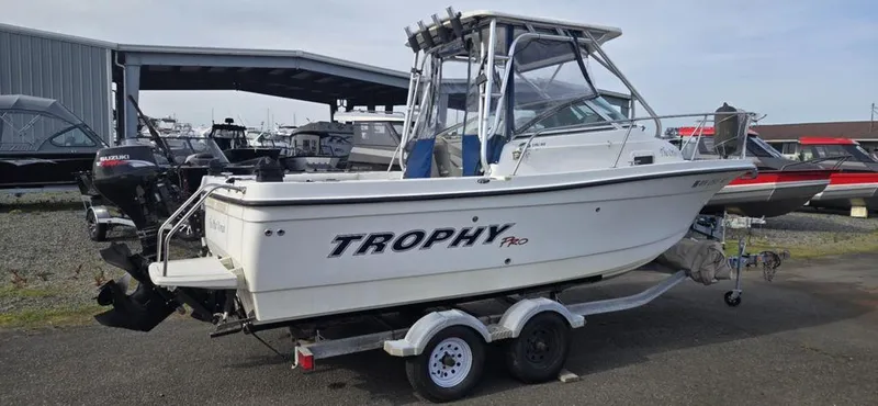 Slide: The Image of 2008 Trophy 2152WA boat on trailer, parked in marina lot. - 14