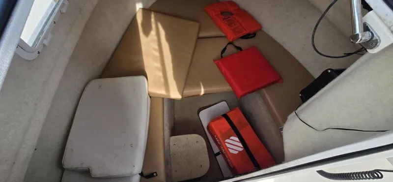 Slide: The Image of 2008 Trophy 2152WA cabin interior with life jackets and cushions. - 4