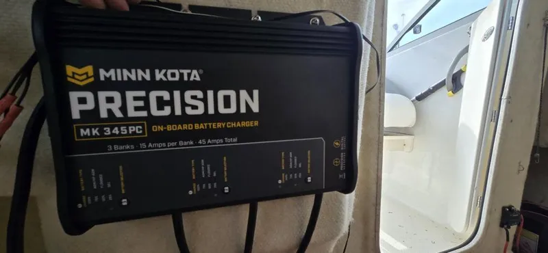 Slide: The Image of Minn Kota Precision MK 345PC on-board battery charger inside 2008 Trophy 2152WA boat. - 5
