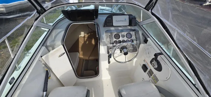 Slide: The Image of 2008 Trophy 2152WA boat interior with steering wheel and Garmin navigation system. - 7