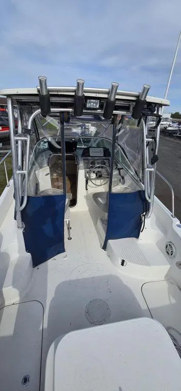 Slide: The Image of 2008 Trophy 2152WA boat interior with rod holders and cockpit view. - 8