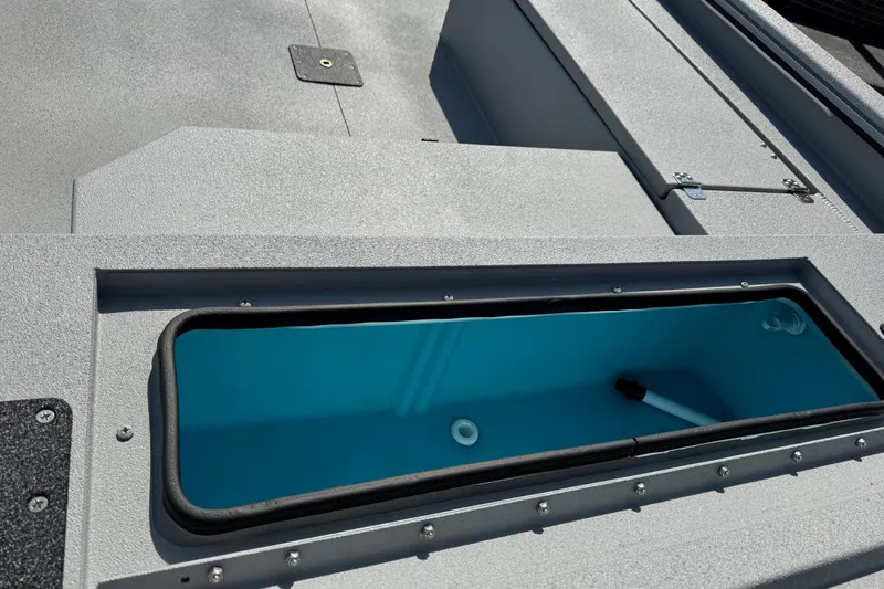 Slide: The Image of 2025 Avid 18 Commander boat interior with open storage compartment. - 16
