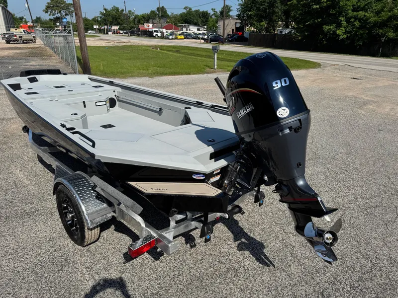 Slide: The Image of 2025 Avid 18 Commander boat with Yamaha 90 outboard motor on a trailer. - 3