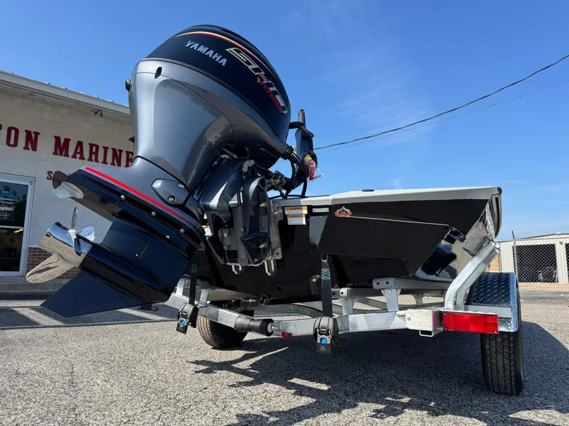 Slide: The Image of 2025 Avid 18 Commander boat with Yamaha outboard motor on a trailer. - 8