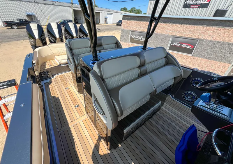 Slide: The Image of 2022 Nor-Tech 390 Sport boat interior with luxurious seating and sleek design. - 16