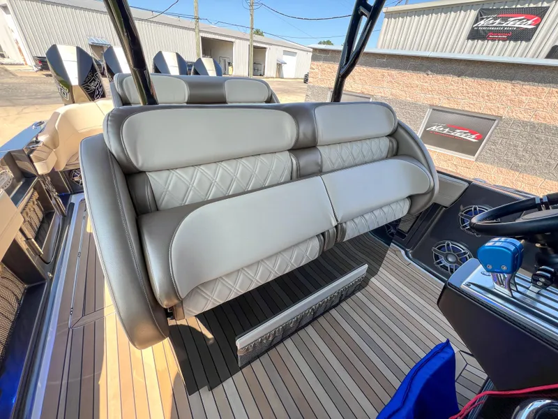 Slide: The Image of 2022 Nor-Tech 390 Sport boat interior with luxurious seating and modern design. - 17