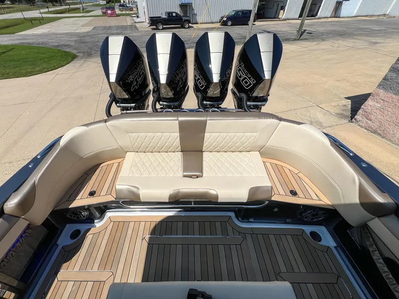 Slide: The Image of 2022 Nor-Tech 390 Sport boat with quad engines and luxurious seating. - 8