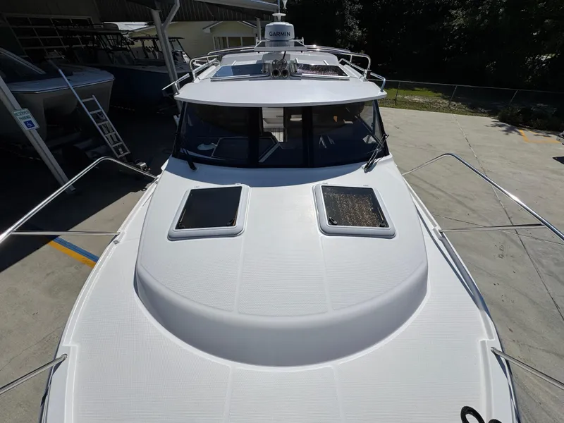 Slide: The Image of 2024 Cutwater C-288 Coupe boat, top view, docked outdoors. - 25