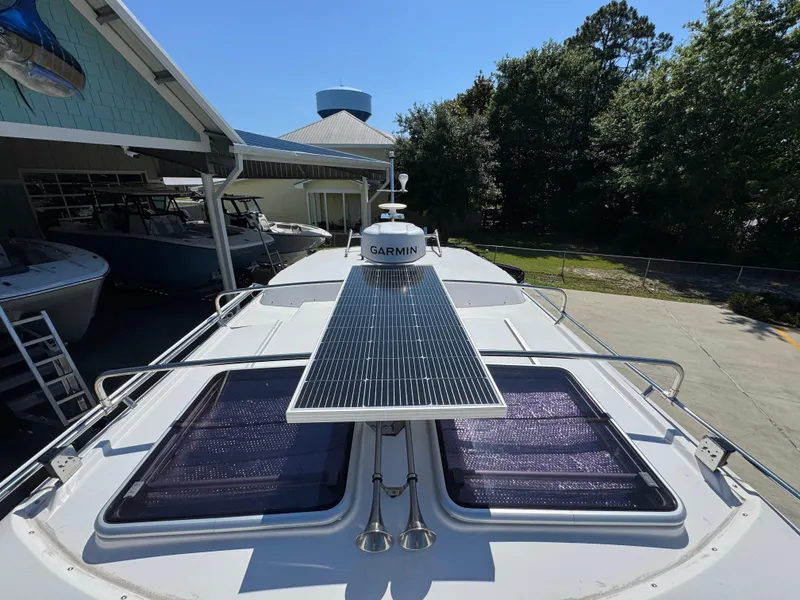 Slide: The Image of 2024 Cutwater C-288 Coupe boat with solar panel and Garmin equipment on deck. - 28