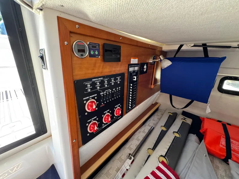 Slide: The Image of 2024 Cutwater C-288 Coupe interior with control panel and storage area. - 46