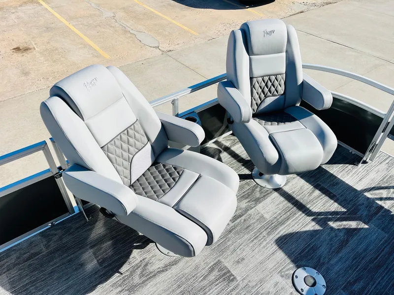 Slide: The Image of 2025 Ranger Reata 223FC boat seats, featuring luxurious gray upholstery and diamond-patterned design. - 13