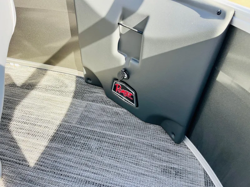 Slide: The Image of Interior view of 2025 Ranger Reata 223FC boat with carpeted flooring. - 15