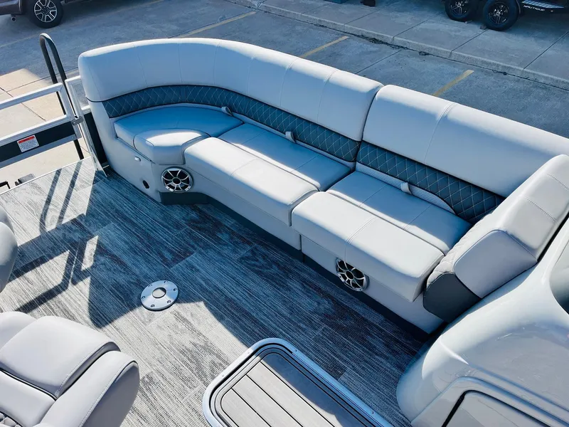 Slide: The Image of 2025 Ranger Reata 223FC boat interior with gray seating and modern design. - 17