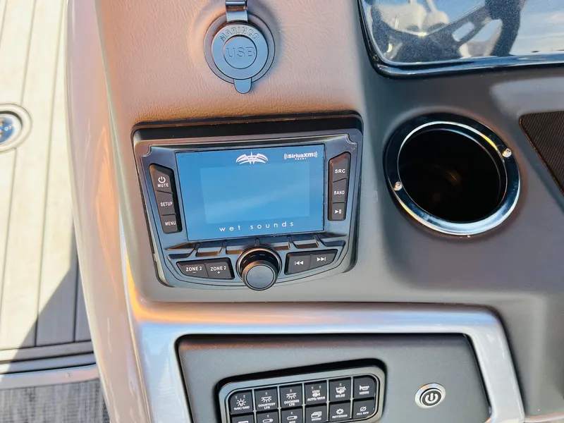 Slide: The Image of Control panel of 2025 Ranger Reata 223FC boat with audio system and USB port. - 35