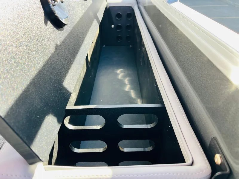 Slide: The Image of Storage compartment in 2025 Ranger Reata 223FC boat, featuring sleek design and ample space. - 40