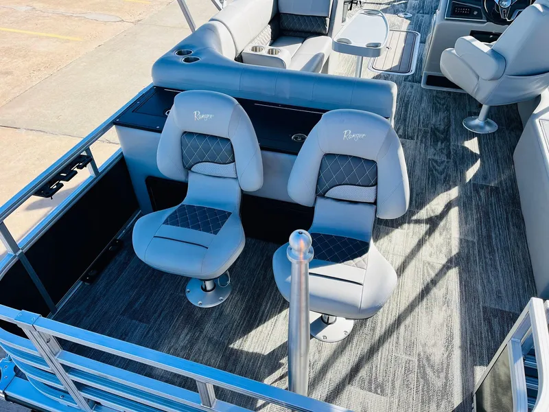 Slide: The Image of 2025 Ranger Reata 223FC boat interior with stylish seating and modern design. - 42