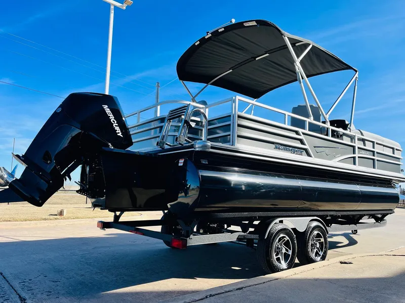 Slide: The Image of 2025 Ranger Reata 223FC pontoon boat with Mercury outboard engine on trailer. - 5