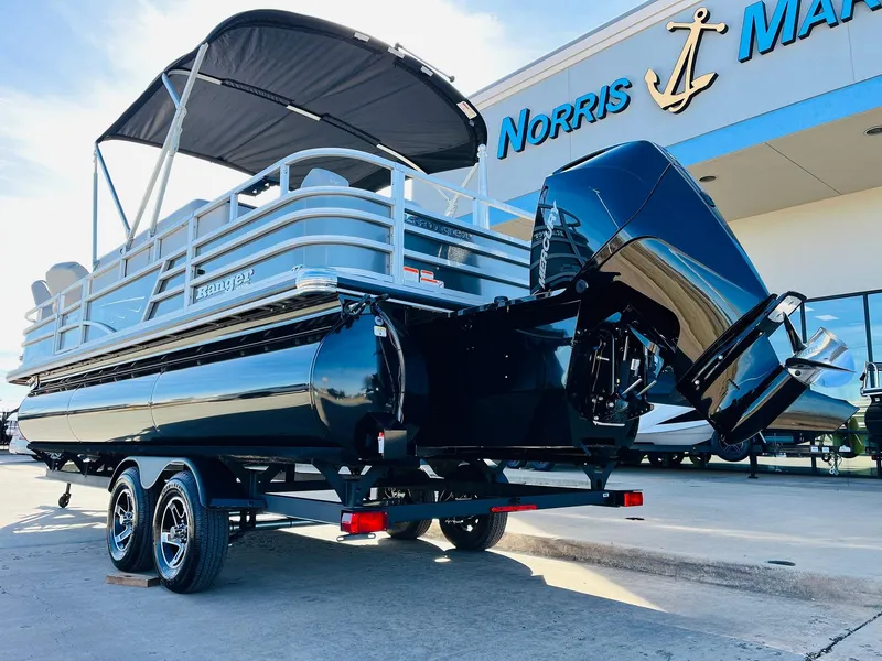 Slide: The Image of 2025 Ranger Reata 223FC pontoon boat with canopy at Norris Marine dealership. - 8