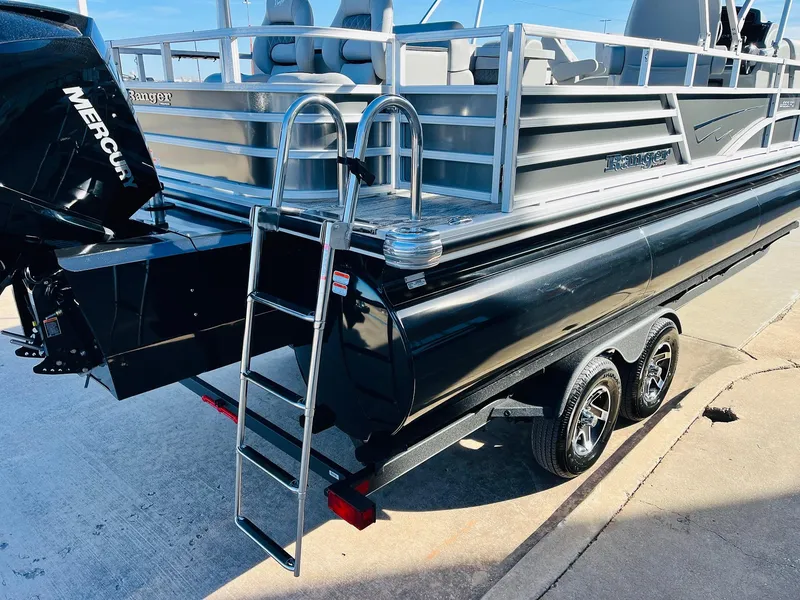Slide: The Image of 2025 Ranger Reata 223FC boat with ladder and Mercury engine on trailer. - 9