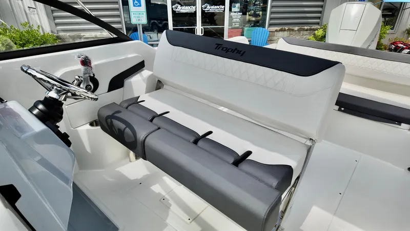 Slide: The Image of 2025 Bayliner Trophy 22 Side Console interior with steering wheel and seating. - 13
