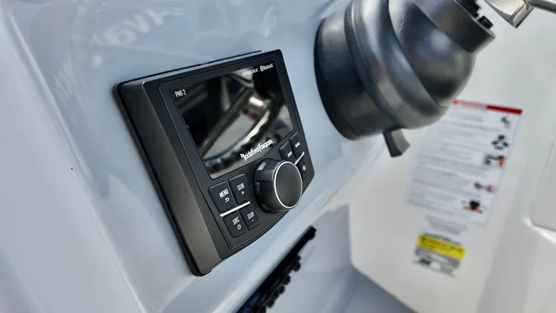 Slide: The Image of 2025 Bayliner Trophy 22 Side Console dashboard with modern control panel. - 15