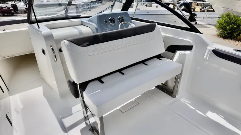 Slide: The Image of 2025 Bayliner Trophy 22 Side Console interior with sleek seating and modern dashboard. - 21