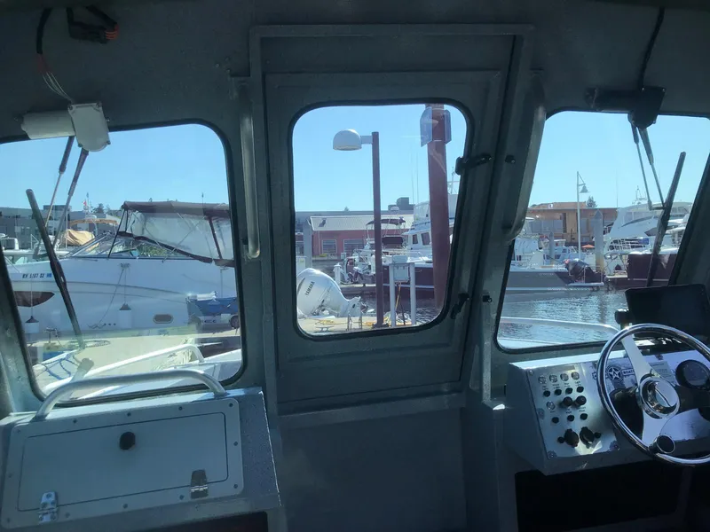 Slide: The Image of Interior view of a 2021 Defiance San Juan 220 boat at a marina. - 13