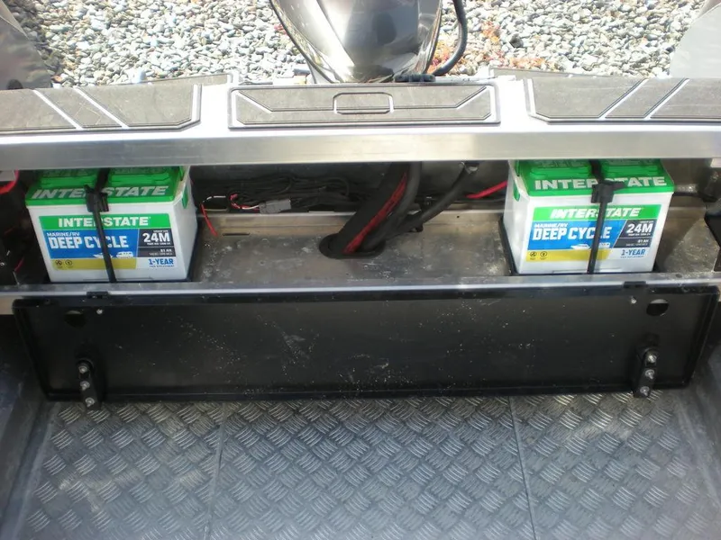 Slide: The Image of 2024 Stabicraft 1550 Fisher boat battery compartment with Interstate deep cycle batteries. - 2