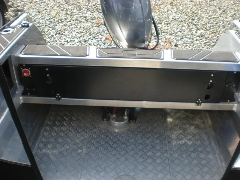 Slide: The Image of 2024 Stabicraft 1550 Fisher boat interior with diamond-patterned flooring and motor mount. - 3