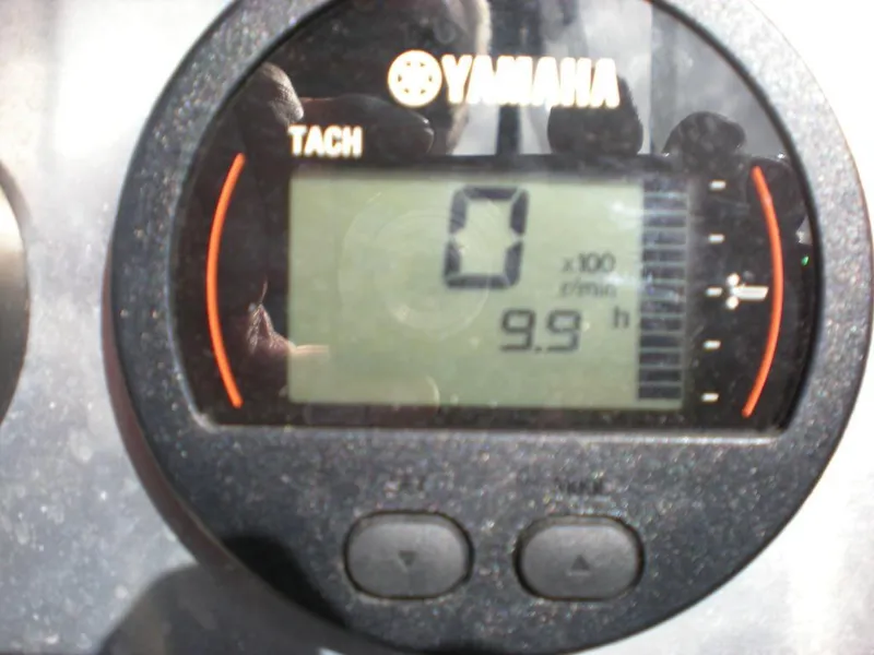 Slide: The Image of Yamaha tachometer displaying 0 RPM and 9.9 hours on a 2024 Stabicraft 1550 Fisher. - 4