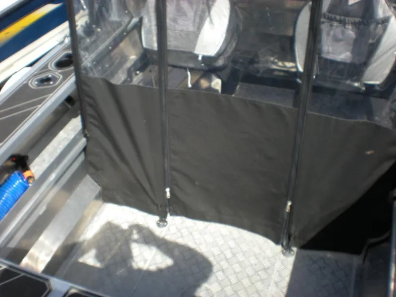 Slide: The Image of 2024 Stabicraft 1550 Fisher interior with protective cover and seating area. - 8