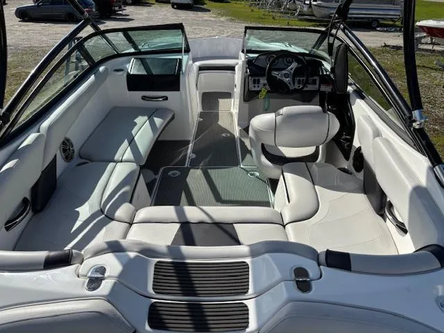 Slide: The Image of 2014 Yamaha Boats AR192 interior with white seating and steering wheel. - 10