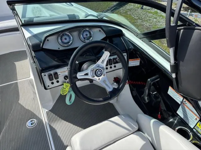 Slide: The Image of 2014 Yamaha Boats AR192 dashboard with steering wheel and controls. - 11