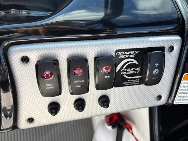 Slide: The Image of Control panel of 2014 Yamaha Boats AR192 featuring various switches and buttons. - 18