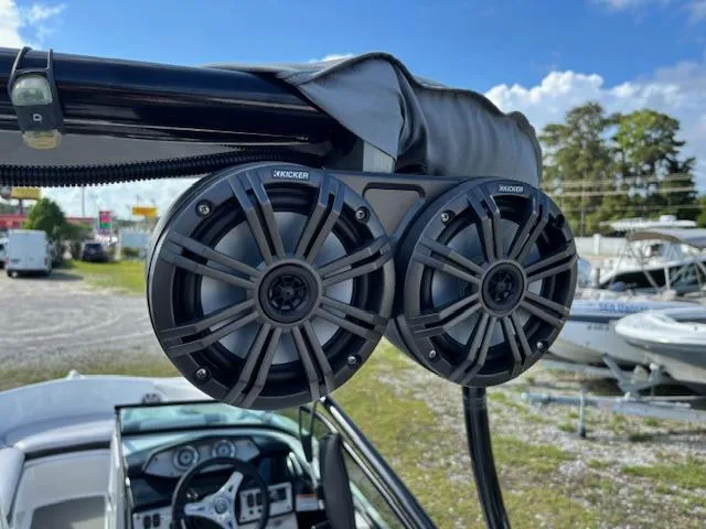 Slide: The Image of Speakers on a 2014 Yamaha Boats AR192, with a clear sky and boats in the background. - 21