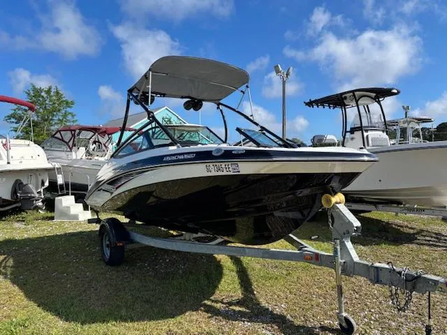 Slide: The Image of 2014 Yamaha Boats AR192 on trailer, parked outdoors under a clear blue sky. - 3