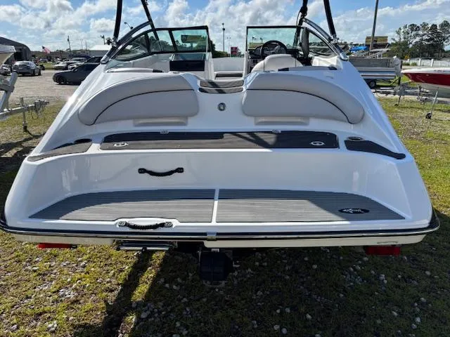 Slide: The Image of 2014 Yamaha Boats AR192, rear view, white exterior, parked outdoors on grass. - 7