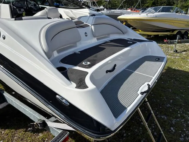Slide: The Image of 2014 Yamaha Boats AR192, sleek design, rear view on trailer, outdoor display. - 9