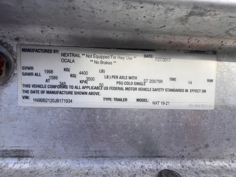 Slide: The Image of Label on 2018 Nextrail 19-21 Tandem Axel trailer, showing specifications and compliance details. - 11