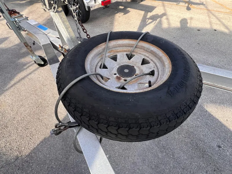 Slide: The Image of Spare tire secured on a 2018 Nextrail 19-21 Tandem Axel trailer. - 5