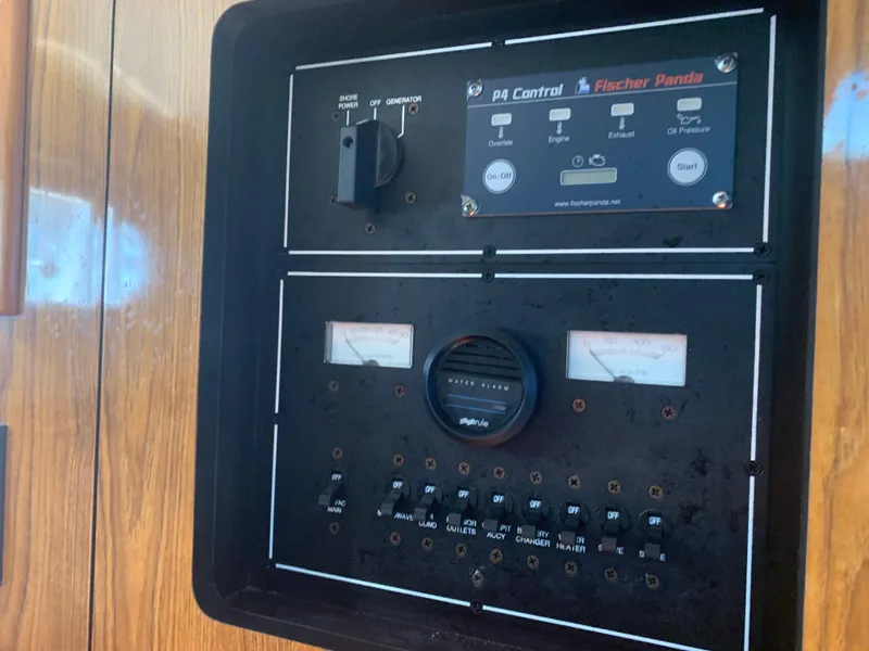 Slide: The Image of Control panel of a 2008 Pursuit 315 OS boat with Fischer Panda generator. - 19