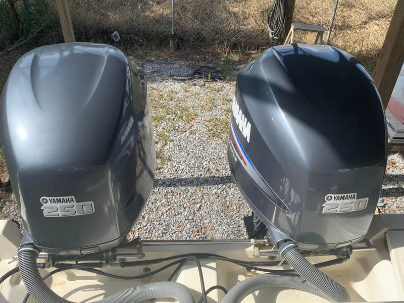 Slide: The Image of Twin Yamaha 250 outboard motors on a 2008 Pursuit 315 OS boat. - 32