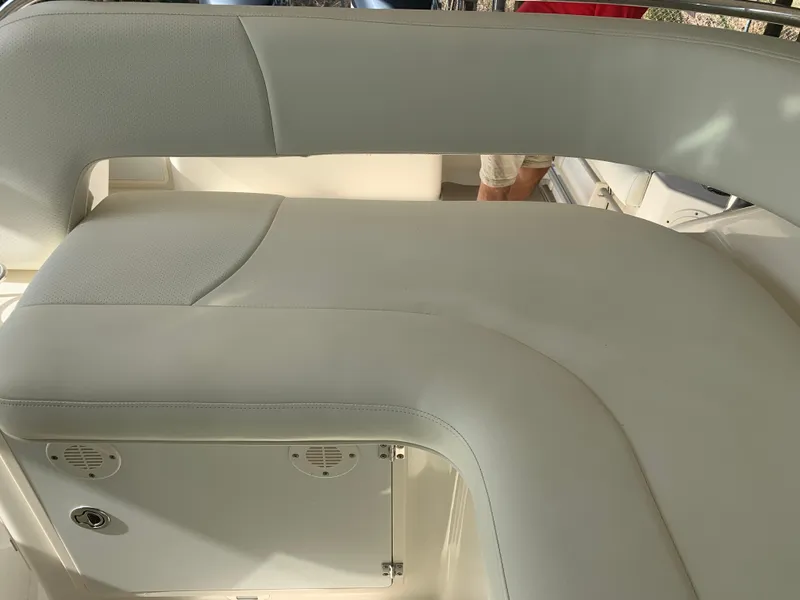 Slide: The Image of 2008 Pursuit 315 OS boat interior seating with light upholstery. - 35